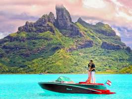 A couple doing a photo shoot in Bora Bora