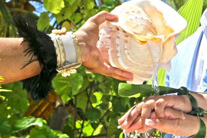 A couple having traditional Polynesian wedding ceremony in Bora Bora
