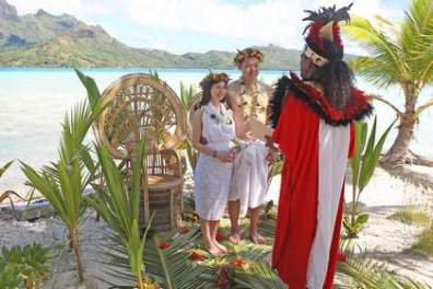 A couple having traditional Polynesian wedding ceremony in Bora Bora