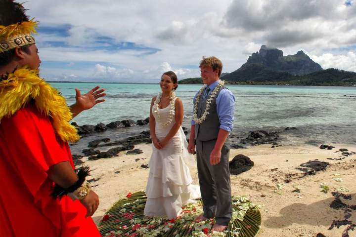 A couple having traditional Polynesian wedding ceremony in Bora Bora