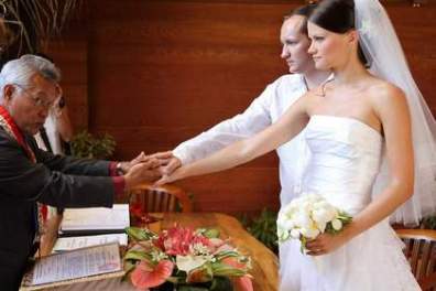 A couple having wedding ceremony in Bora Bora