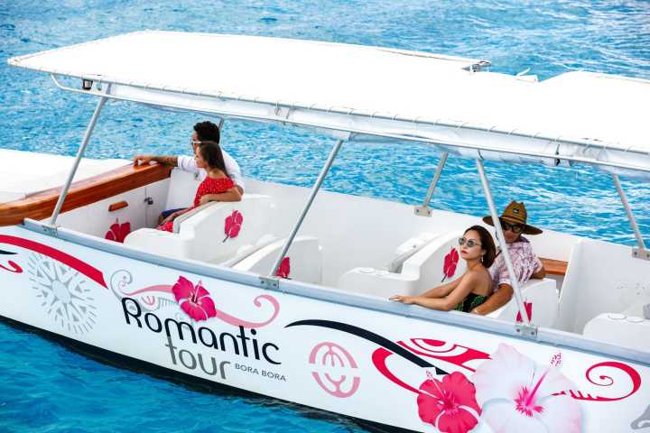 An outrigger canoe sailing in Bora Bora
