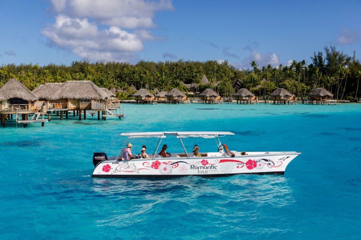 An outrigger canoe sailing in Bora Bora